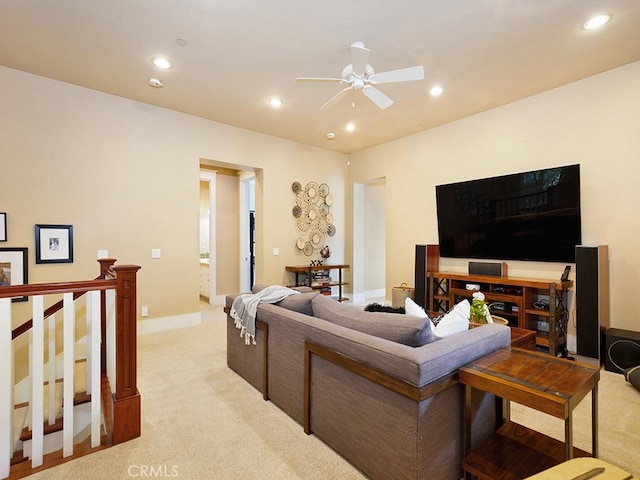 living room featuring ceiling fan and light colored carpet