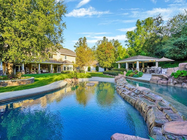 view of pool with a lawn and a gazebo