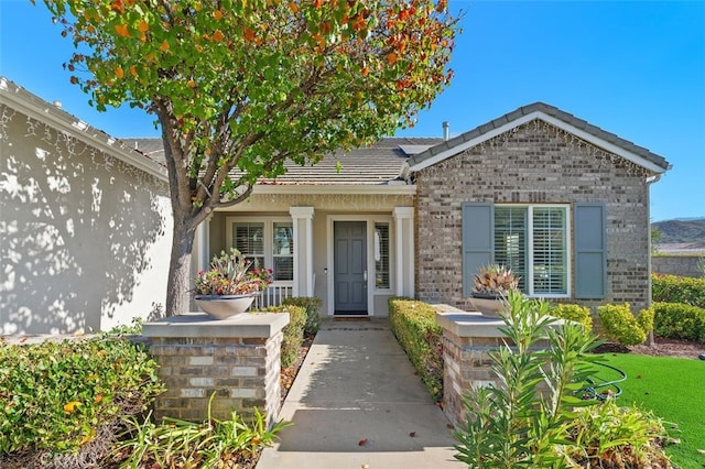 property entrance with covered porch