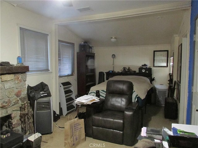 bedroom featuring ceiling fan, light carpet, and lofted ceiling