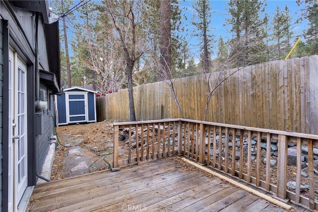 wooden terrace featuring a shed