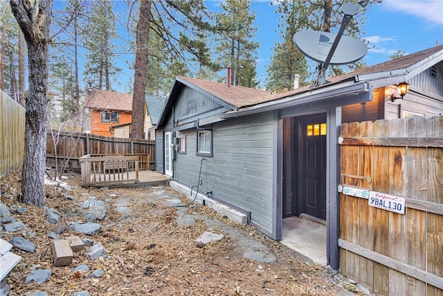 view of side of home featuring a deck