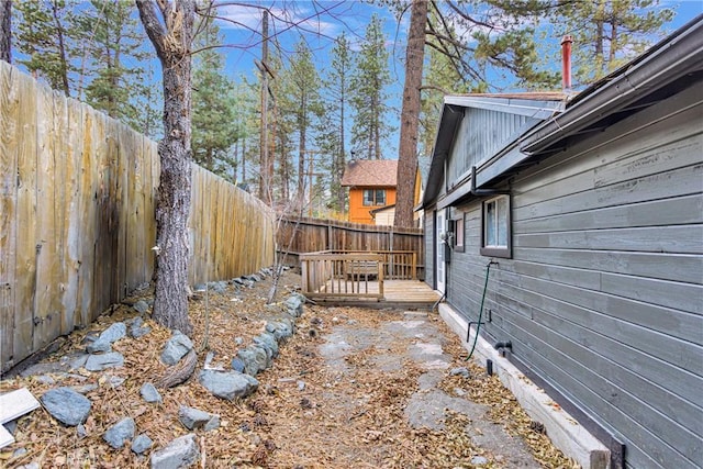 view of yard featuring a wooden deck