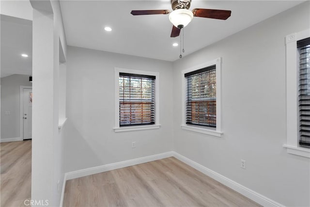 empty room featuring ceiling fan and light hardwood / wood-style flooring