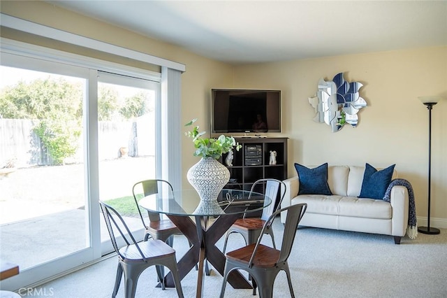 dining space with carpet flooring