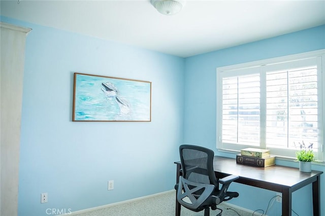 home office with carpet flooring