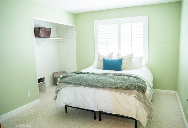 bedroom featuring light carpet