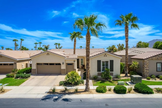 mediterranean / spanish home with a garage