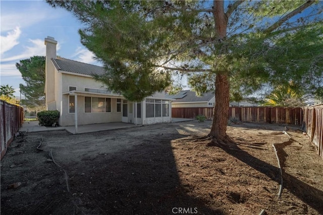 back of property with a patio area