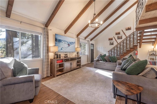 living room featuring dark hardwood / wood-style flooring, high vaulted ceiling, a chandelier, and beamed ceiling