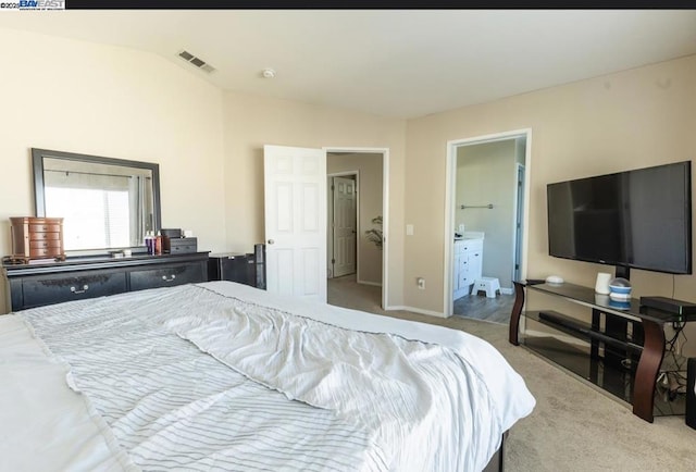 carpeted bedroom featuring connected bathroom