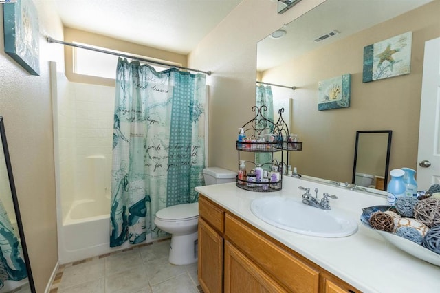 full bathroom featuring toilet, vanity, shower / bath combo, and tile patterned flooring