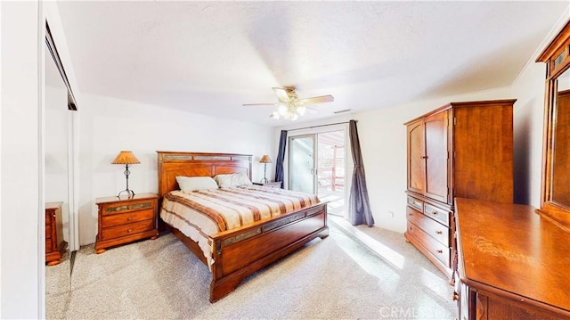 carpeted bedroom with access to exterior and ceiling fan