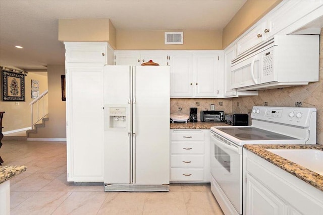 kitchen with white appliances, tasteful backsplash, white cabinetry, and stone countertops