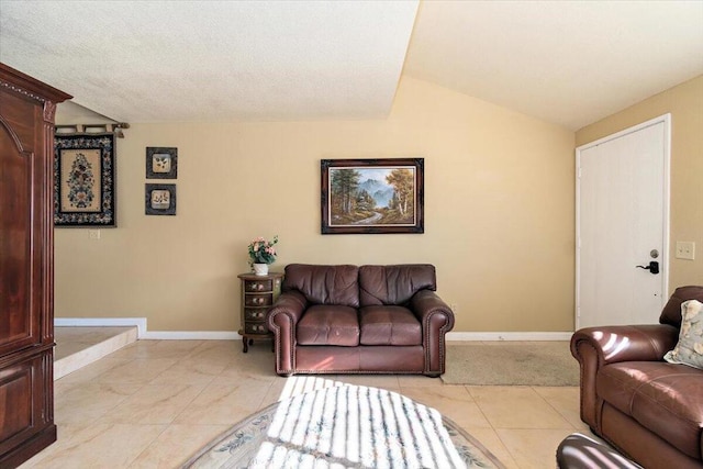 tiled living room with lofted ceiling and a textured ceiling