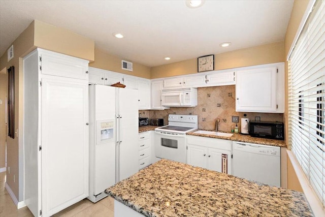 kitchen with white cabinets, white appliances, and sink