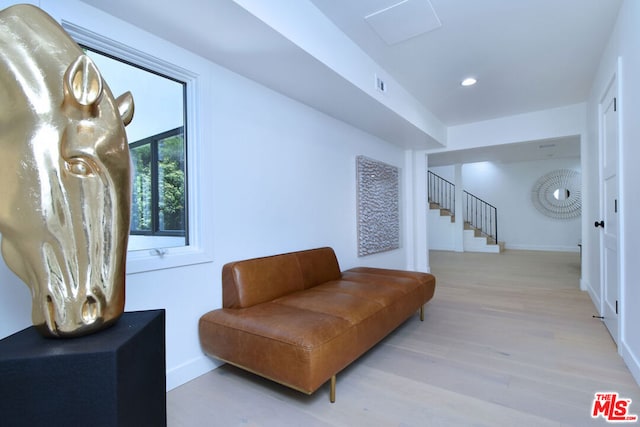 sitting room featuring light hardwood / wood-style flooring