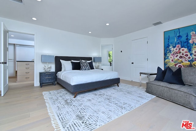 bedroom featuring hardwood / wood-style floors