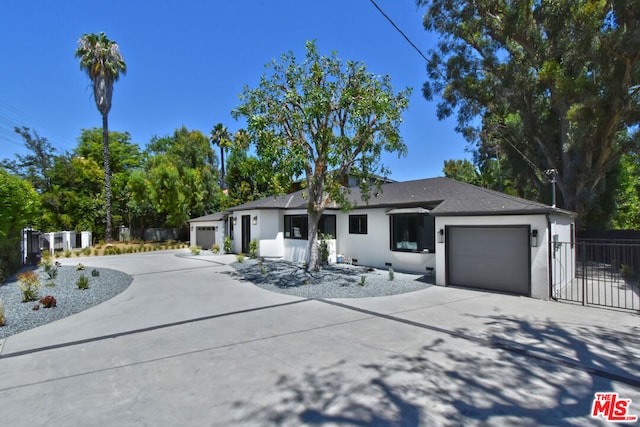 ranch-style home featuring a garage