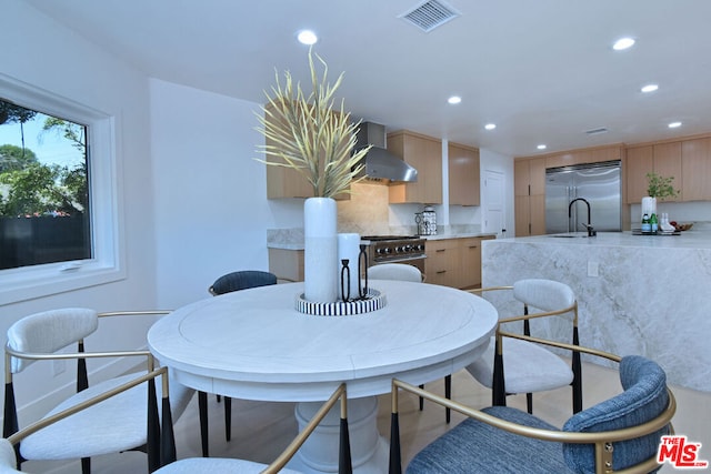 dining area featuring sink