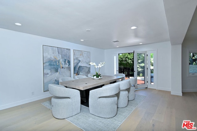 dining space with light wood-type flooring