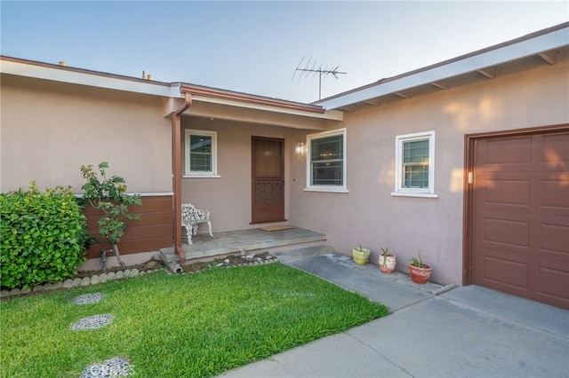 entrance to property with a yard