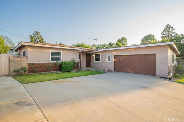 single story home with a garage