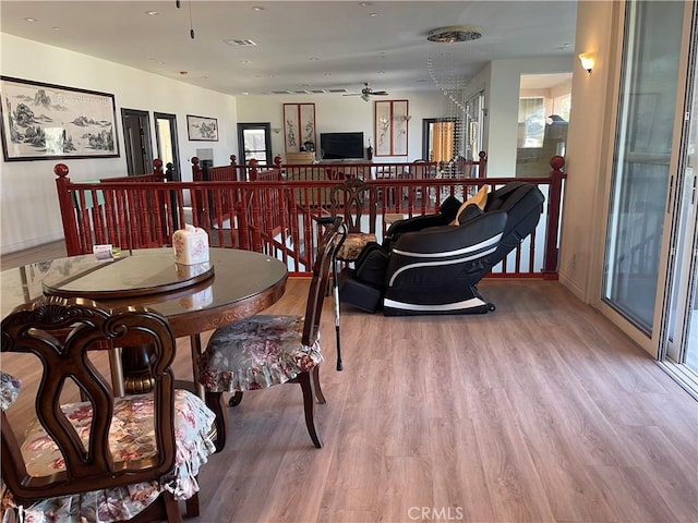 dining room featuring ceiling fan and hardwood / wood-style flooring