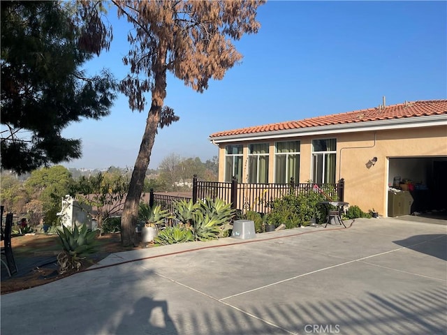 view of property exterior featuring a garage