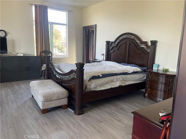 bedroom with light hardwood / wood-style floors