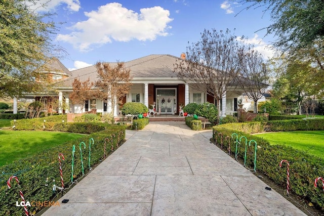 9120 Laramie Ave, Bakersfield, CA 93314 - view of front facade with covered porch and a front yard