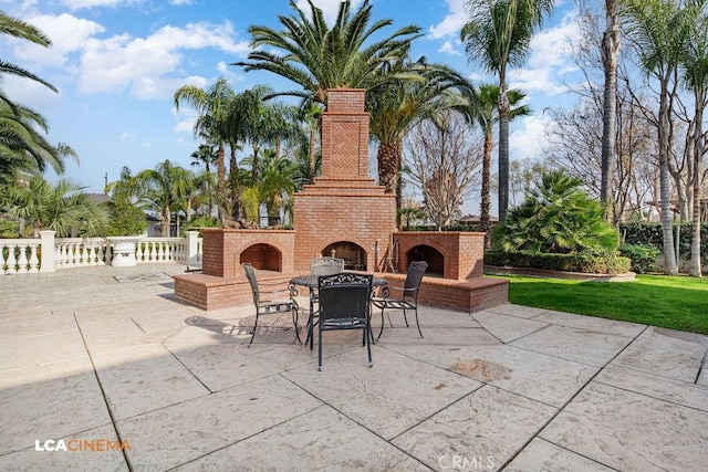 9120 Laramie Ave, Bakersfield, CA 93314 - view of patio / terrace featuring an outdoor brick fireplace