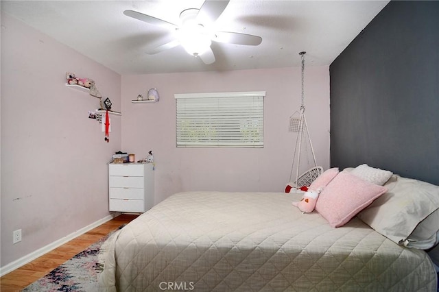 bedroom featuring ceiling fan and hardwood / wood-style floors