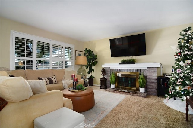 carpeted living room featuring a fireplace