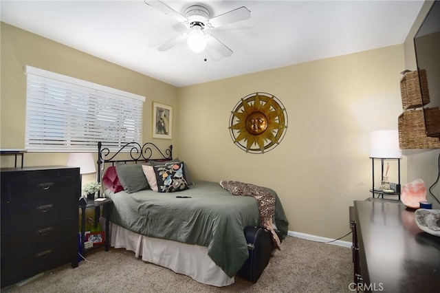 bedroom featuring ceiling fan and light colored carpet