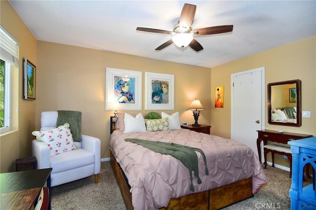 bedroom with ceiling fan and carpet