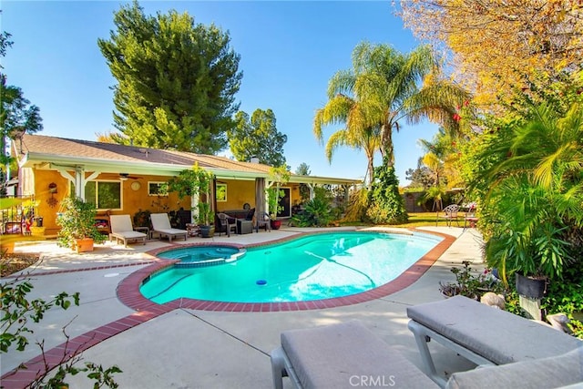 view of pool featuring ceiling fan, an in ground hot tub, and a patio