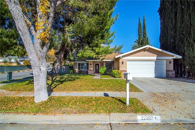 ranch-style house with a garage and a front yard