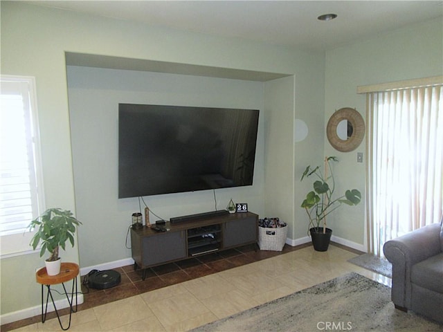 living room featuring dark tile patterned floors