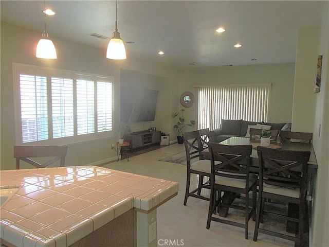 dining area with light tile patterned floors