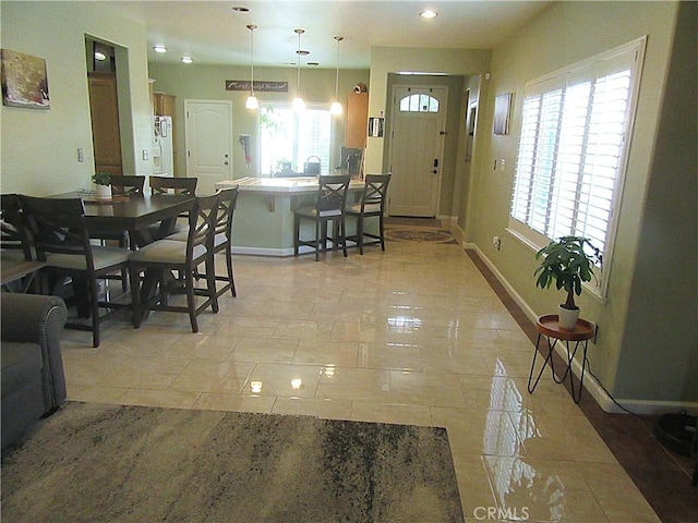 dining room featuring light tile patterned flooring