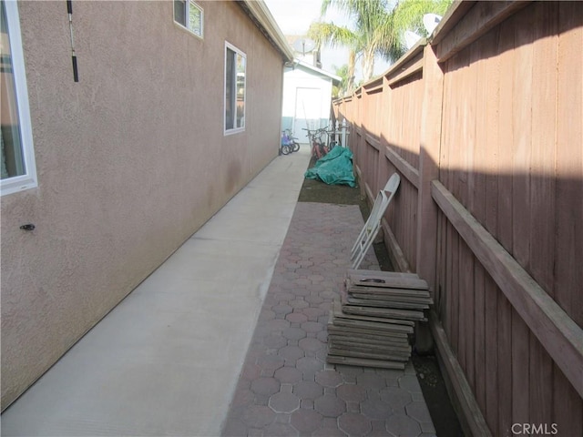 view of property exterior featuring a patio