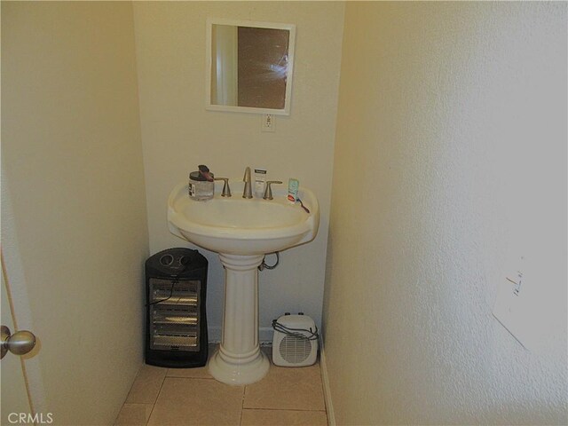 bathroom with tile patterned floors