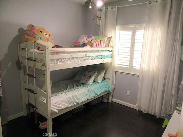 bedroom featuring dark hardwood / wood-style flooring