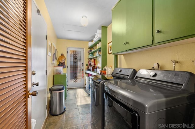 washroom with cabinets and independent washer and dryer