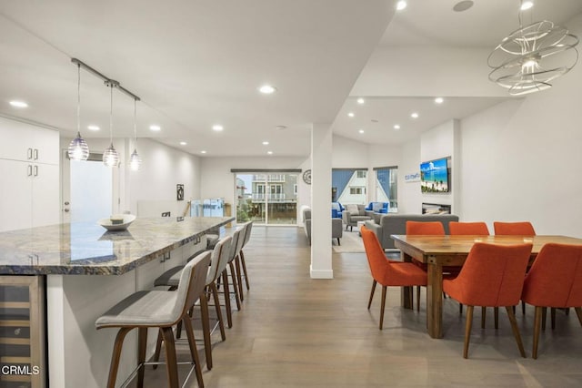 dining room featuring hardwood / wood-style floors and beverage cooler