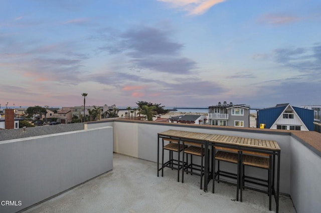 patio terrace at dusk with a balcony