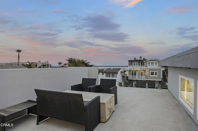 view of patio terrace at dusk