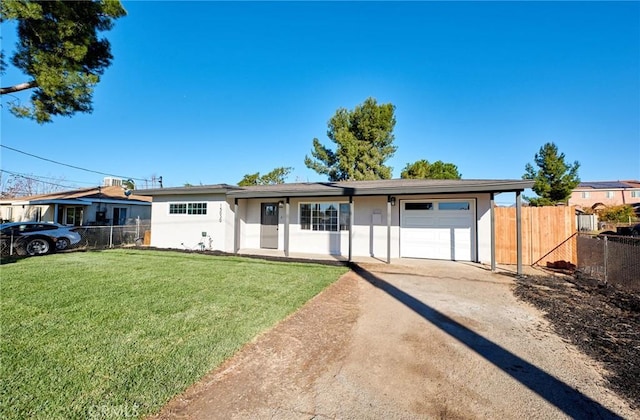 ranch-style house with a garage and a front lawn