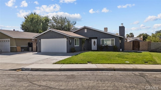 ranch-style house featuring a front yard and a garage